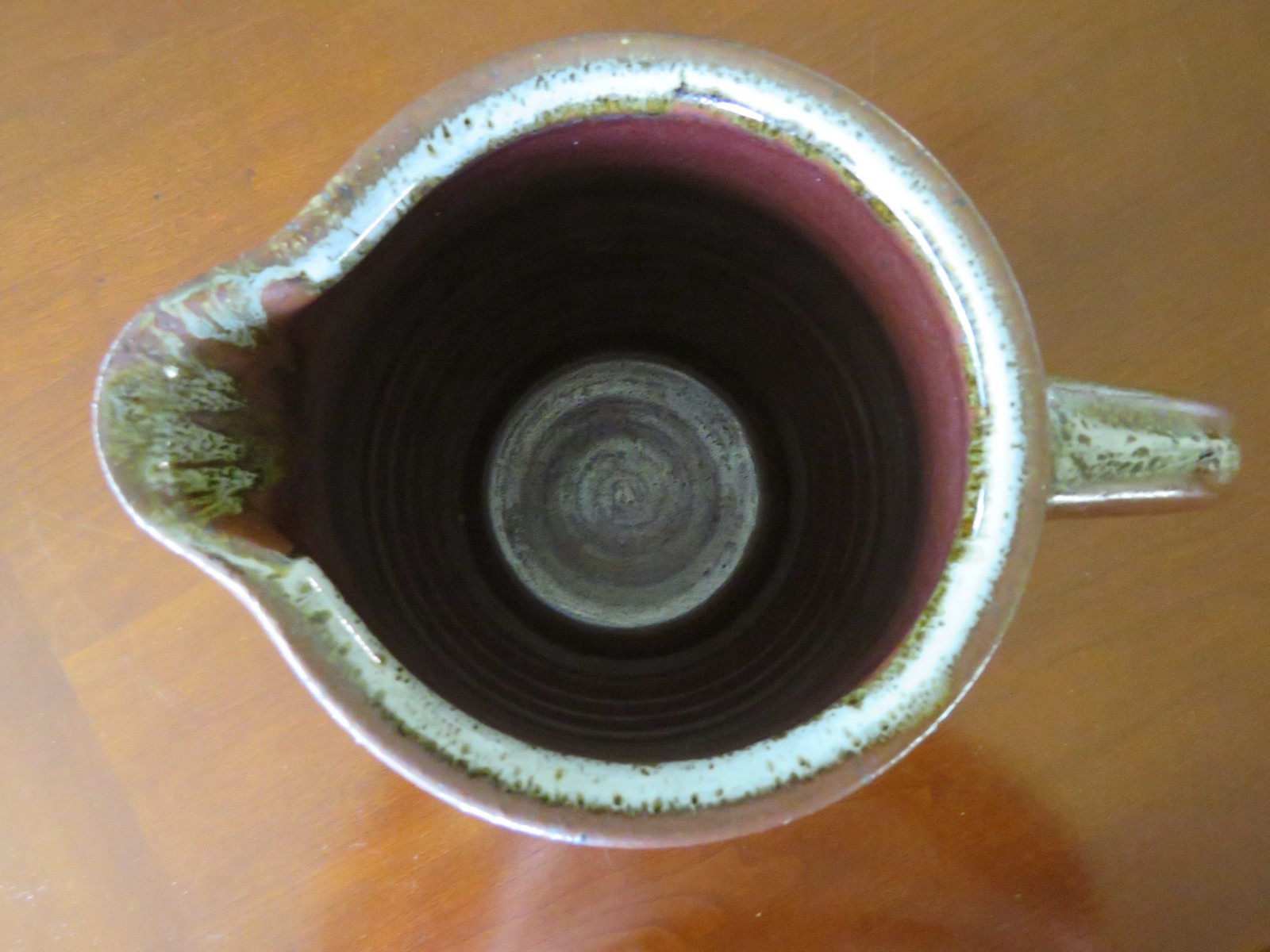 Handmade ceramic pitcher or vase rustic red browns with handle spout 5″x7 1/2″