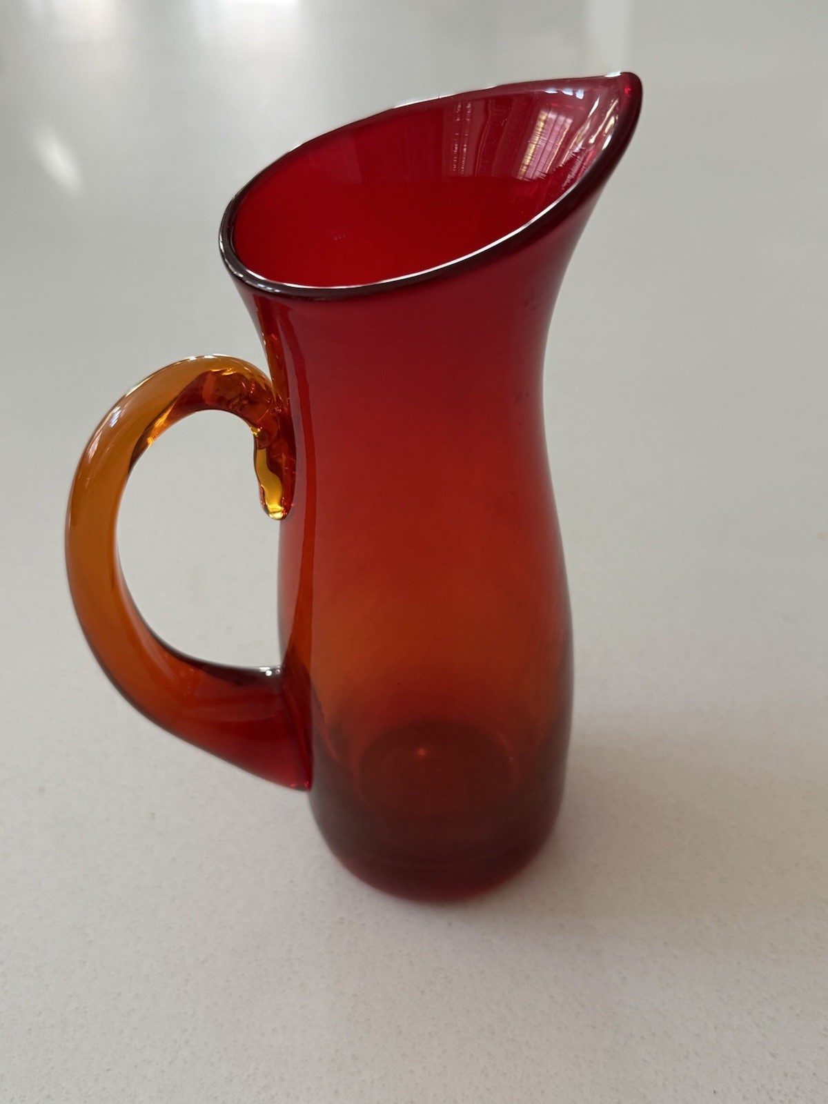 Vintage Small Amberina Glass Hand Blown Glowing Pitcher with Orange Handle 7.5”