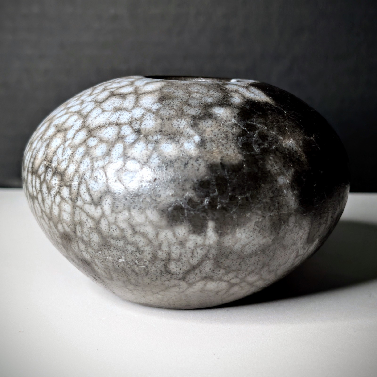 Small Naked Raku Orb “Naked Roku” Bone-White Fine-Lined Black Carbon Crackle