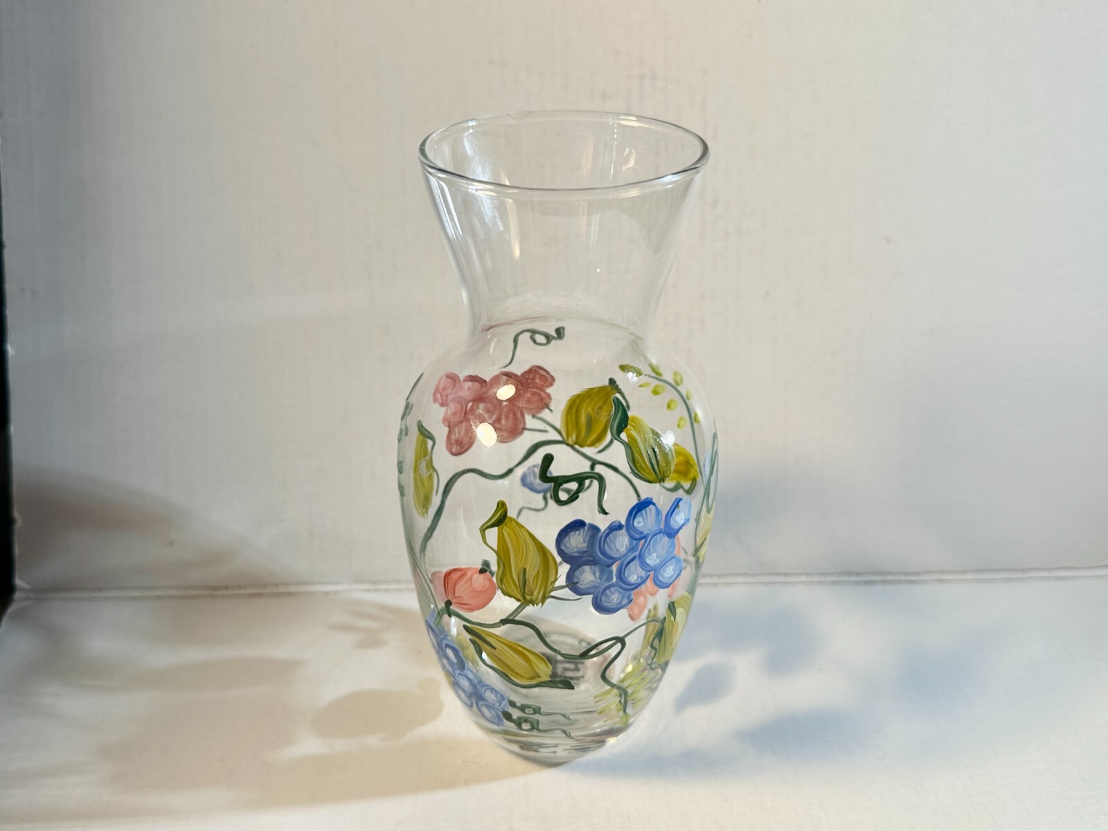 Beautiful hand painted glass vase. 6.0″ tall. Grape images. Hand wash only.
