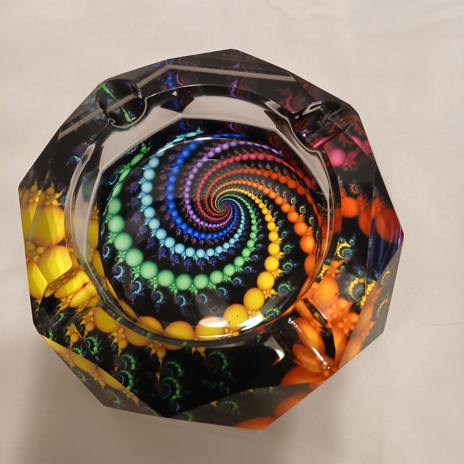 Geometric Faceted Ashtray with colors showing thru out the Facets from Bottom.