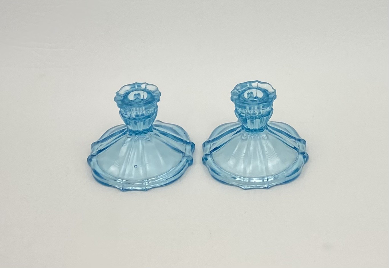 Small blue glass uranium UV glow chamber style candlestick holders