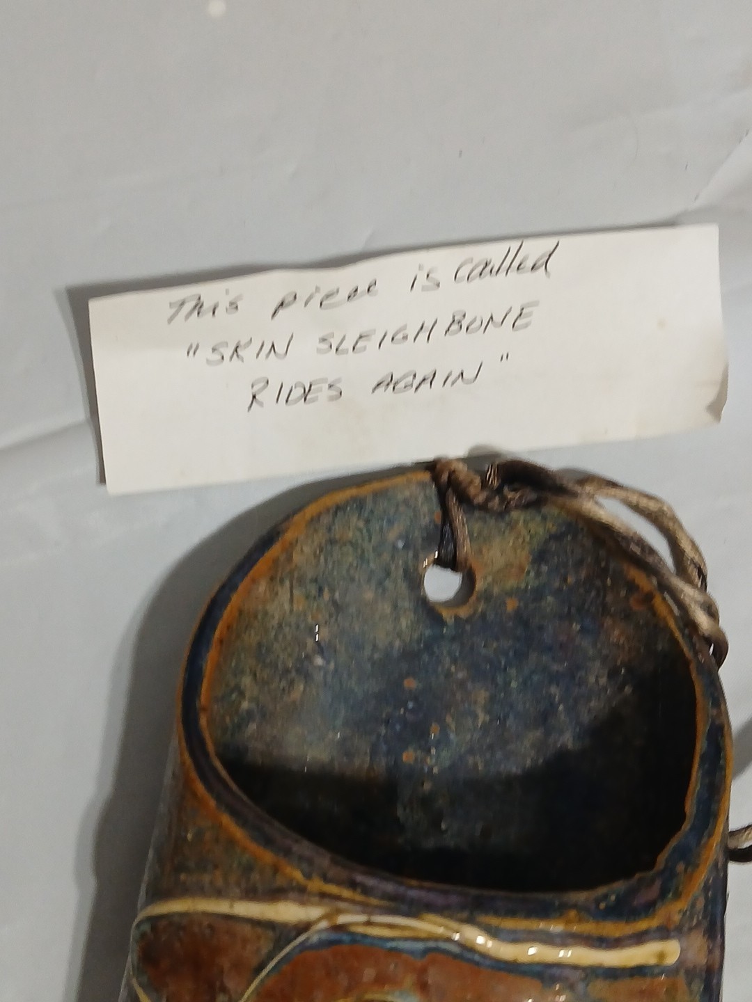 Art Pottery Wall Pocket W/attached Heart Called “Skin Sleigh bone rides again.”