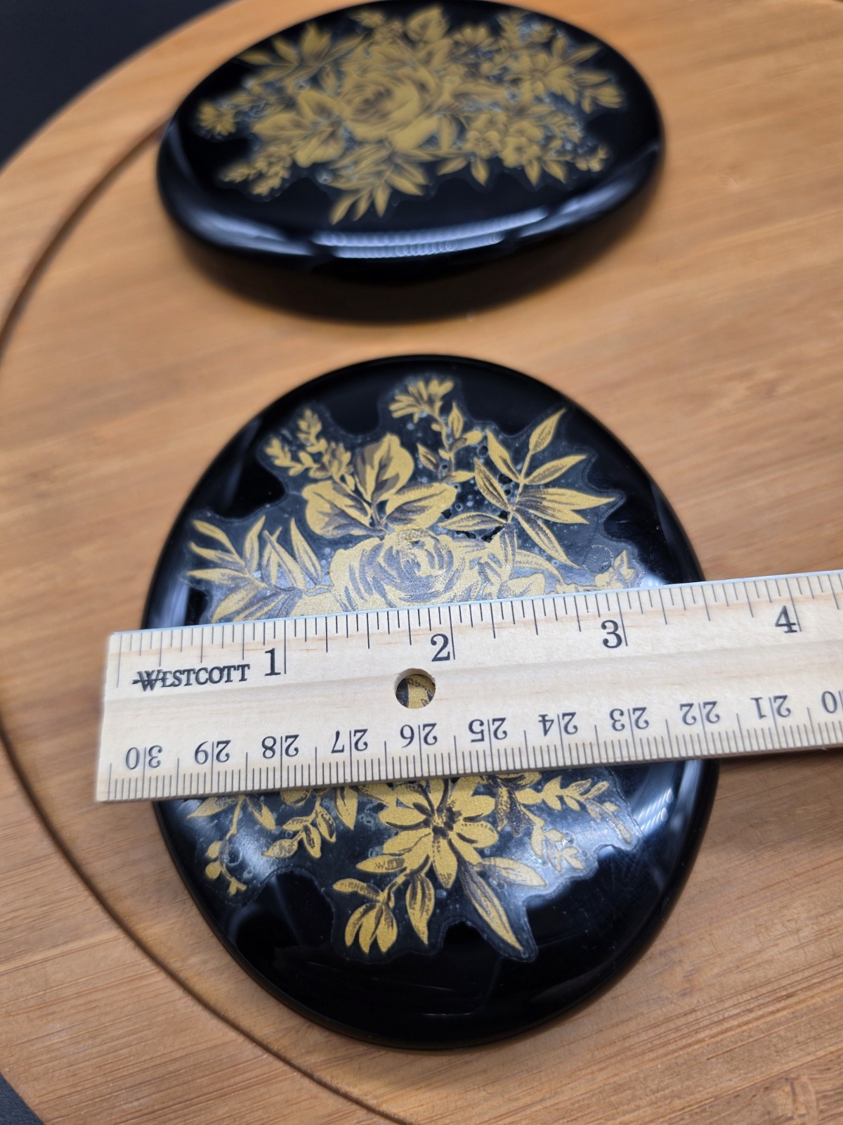 Pair Of Black Glass Paperweights With Applied Floral Design