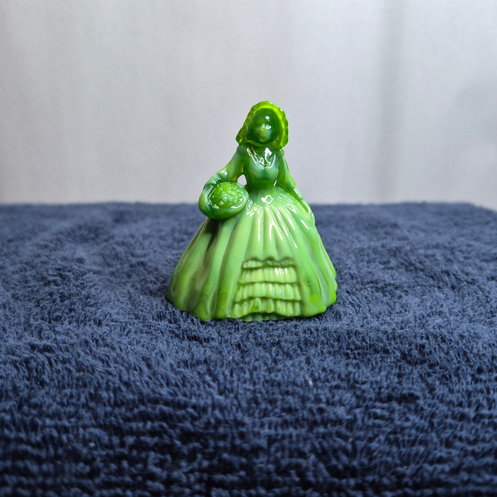 boyd green slag glass girl figurine holding a basket 2-1/2″ tall
