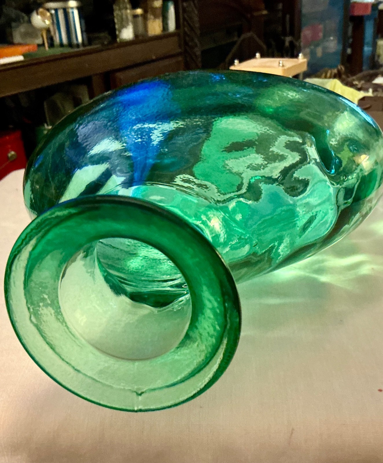 green glass vintage wide bottle or vase sticker on bottom says Spain