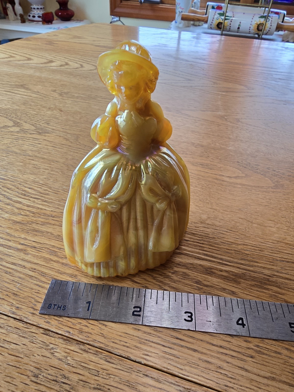 This glass figurine Is A Boyd Art Glass “Marguerite” Colonial Doll.