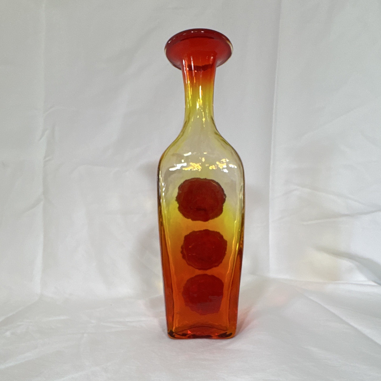 Amberina glass bottle vase produced by the Rainbow Art Glass Company