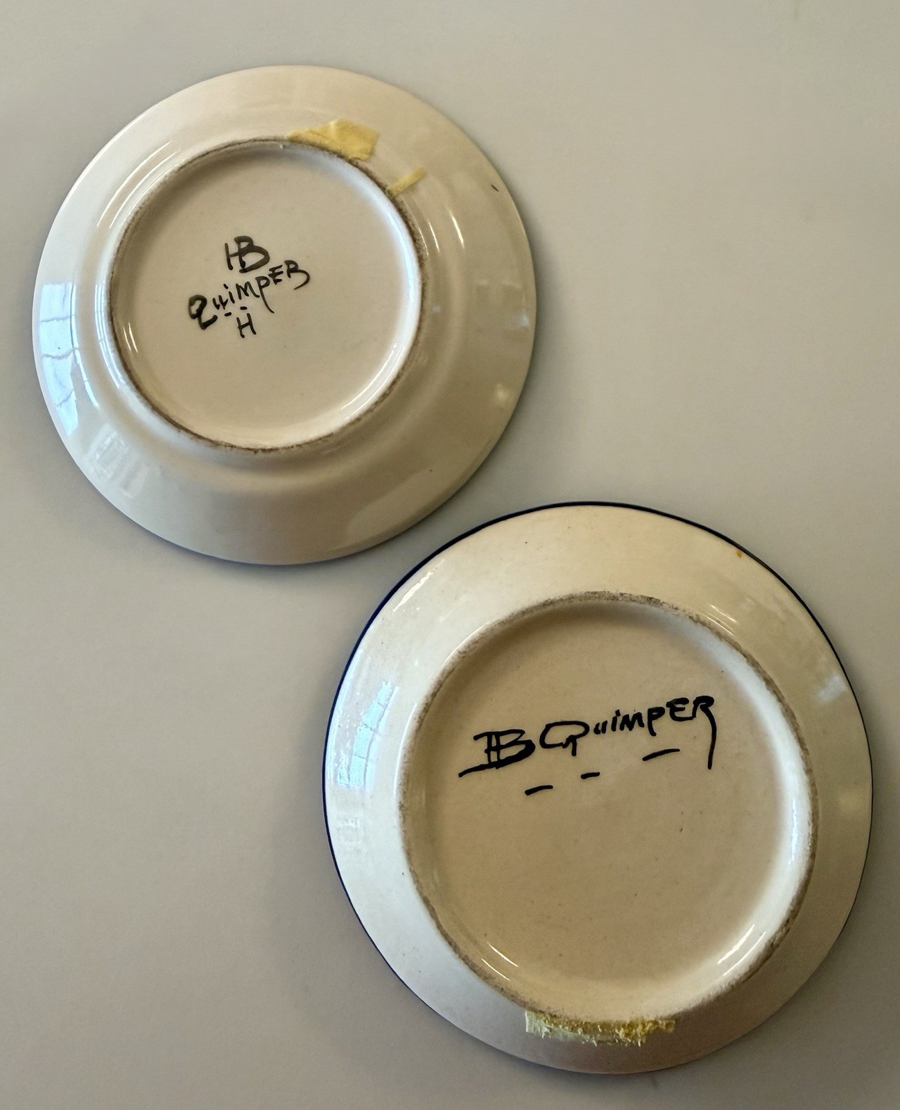 Two Hand-Painted Quimper Breton Faience Portrait Plates Circa 1930. Signed HB.