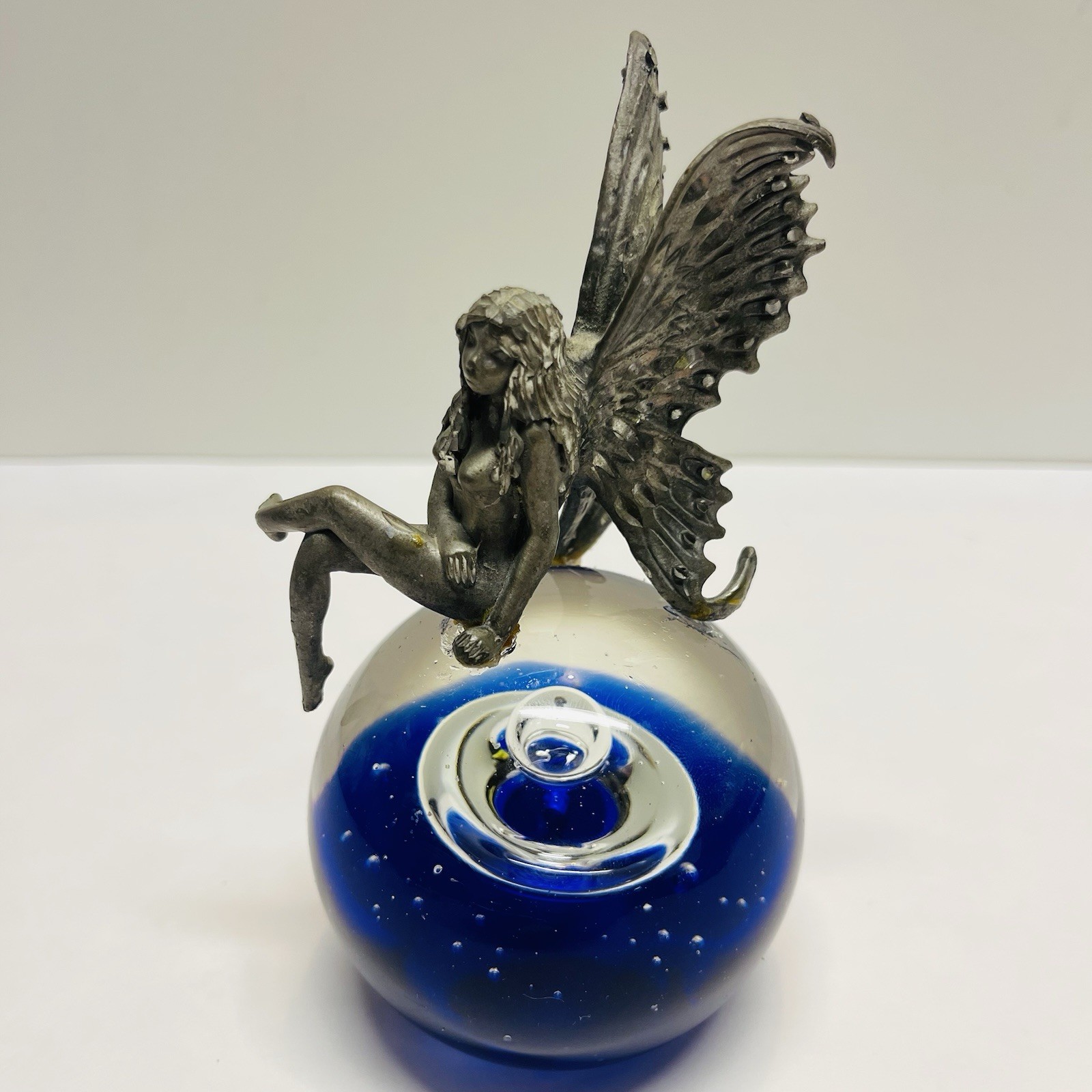Pewter Fairy Sitting On Cobalt Blue Controlled Bubbles Art Glass Paper Weight