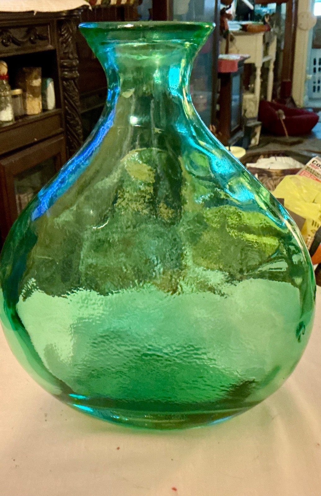green glass vintage wide bottle or vase sticker on bottom says Spain