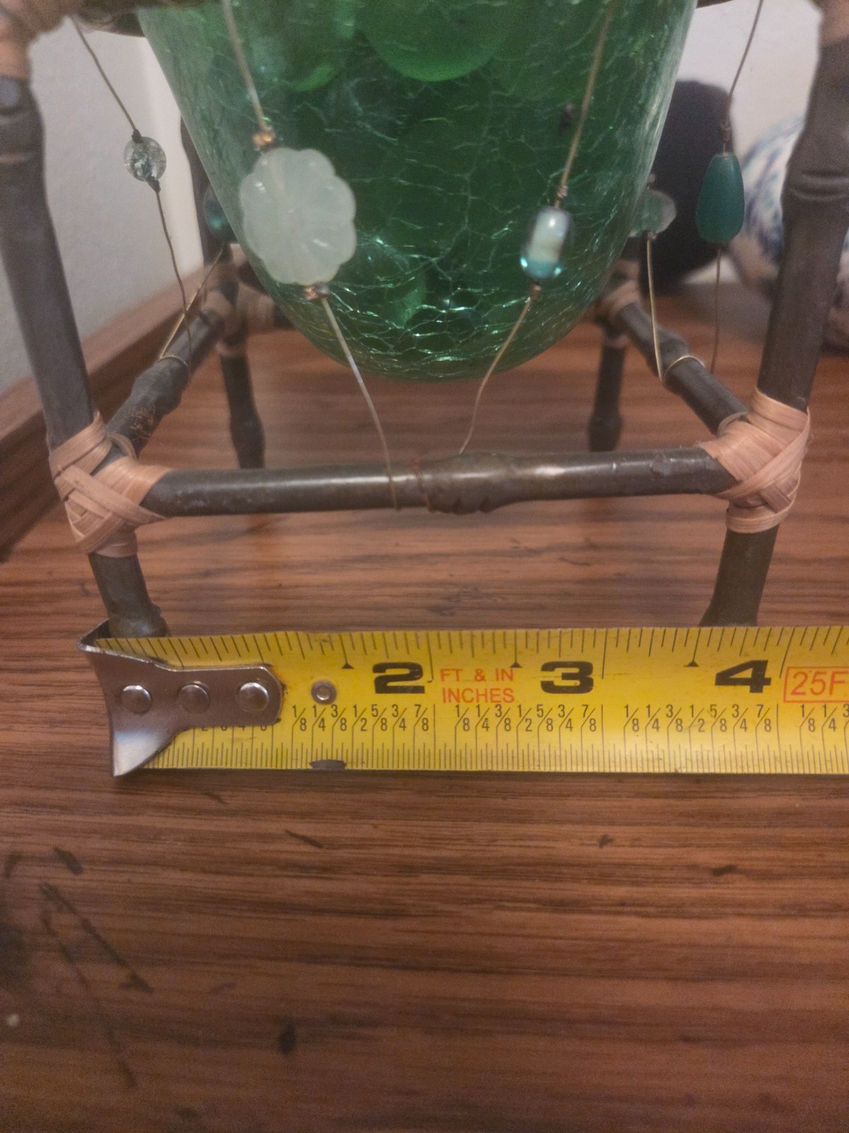 Handmade green beaded art dish, candle, decorative stones.