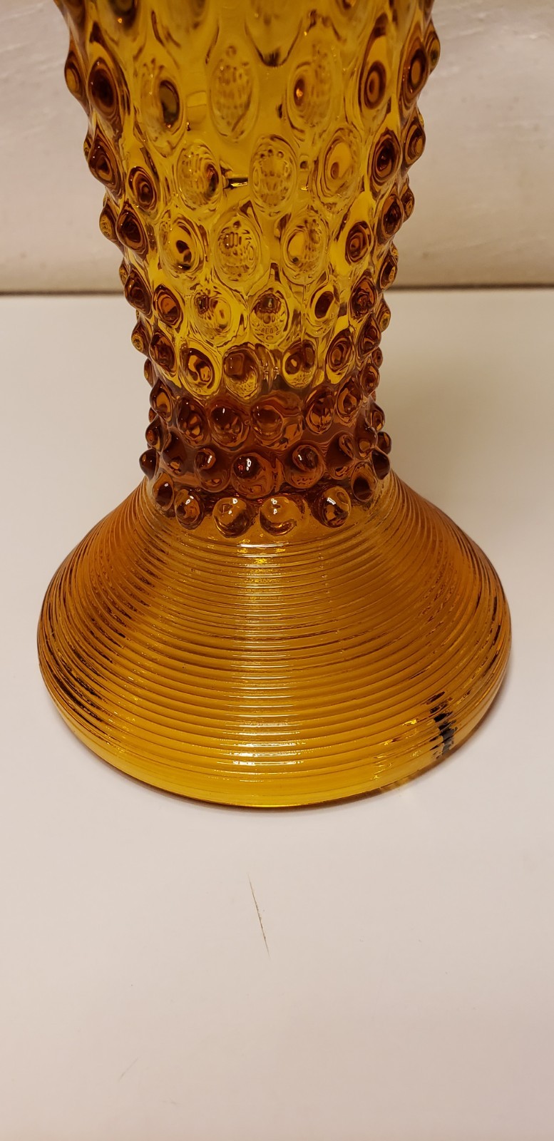 Hobnail Pattern Stretch Glass Vase. Amber Pedestal Bottom Glass Vase. 14″ High.