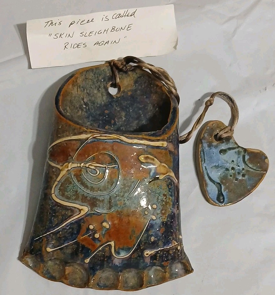 Art Pottery Wall Pocket W/attached Heart Called “Skin Sleigh bone rides again.”