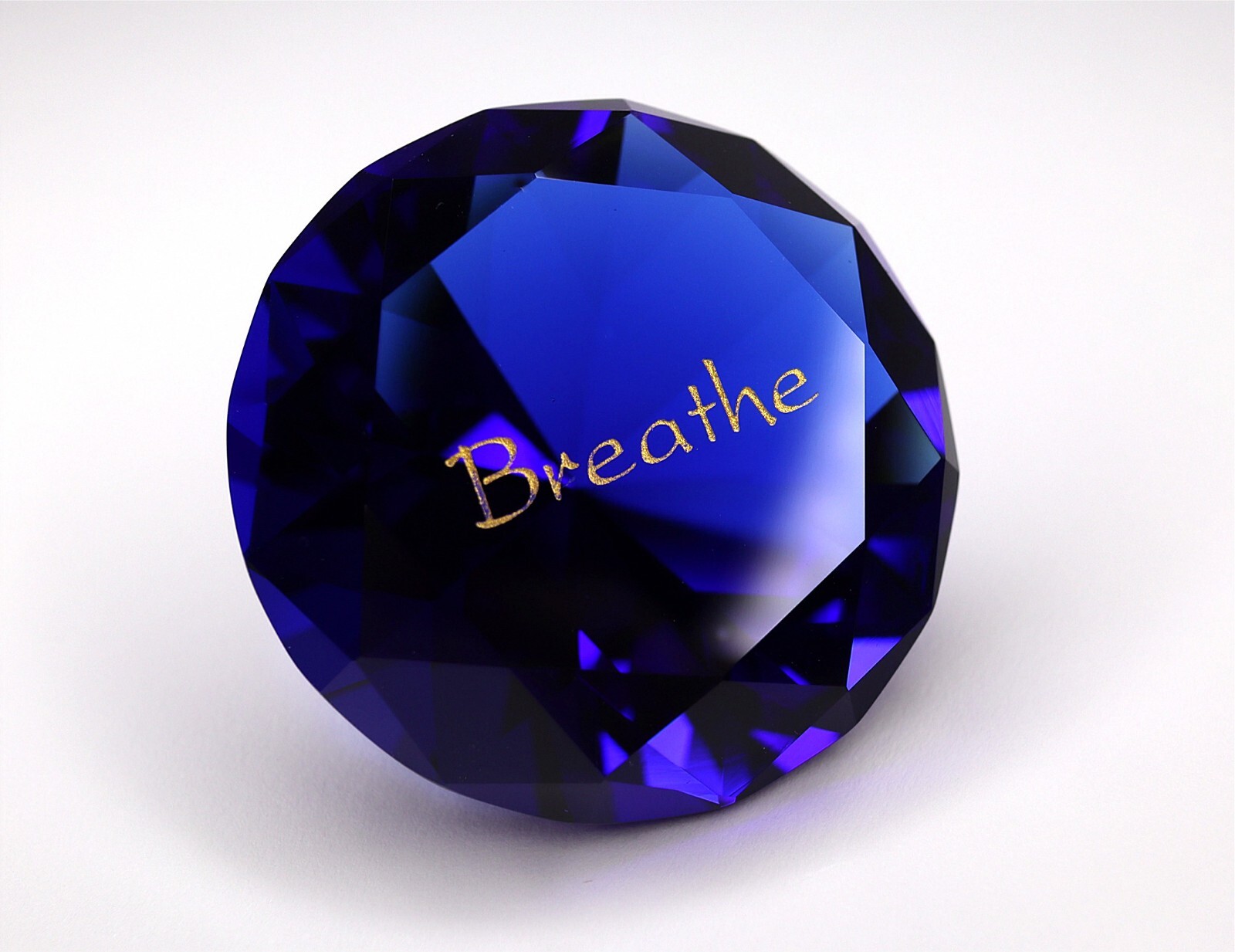 Sapphire Blue Paperweight – Weight: 4.3 oz – Measures 2 3/8″ – Text: Breathe