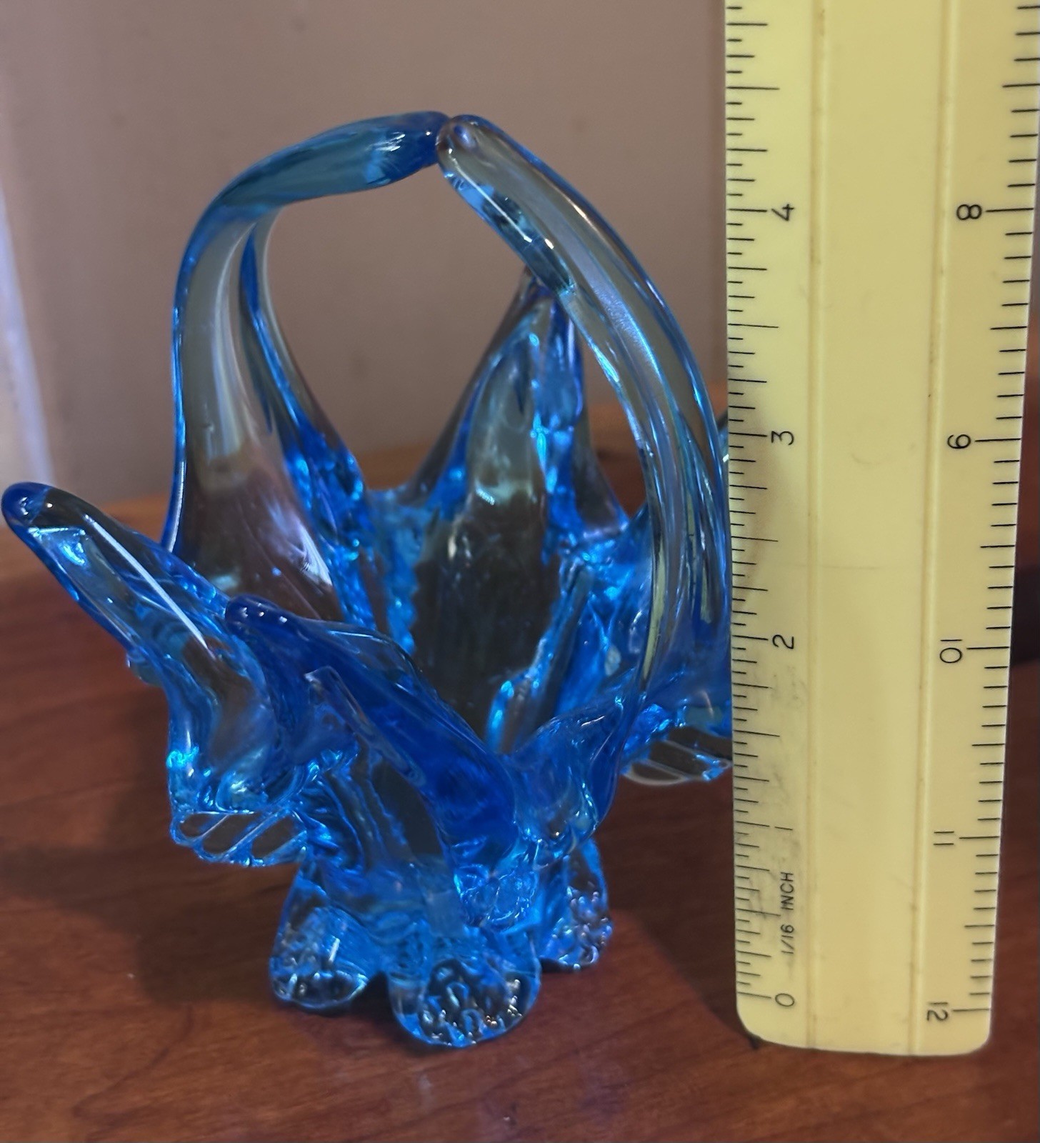 small vintage blue Chalet glass basket featuring a distinctive split handle