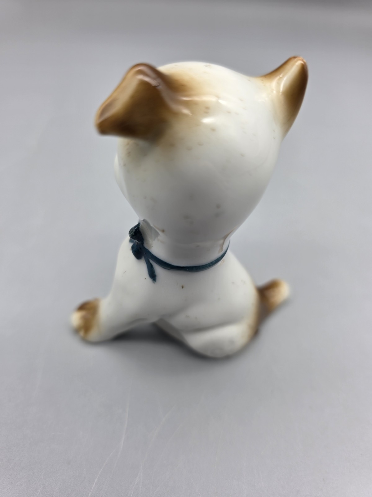 Vintage Porcelain Puppy Dog Figurine W Fly on Nose Brown Speckled Germany #5562