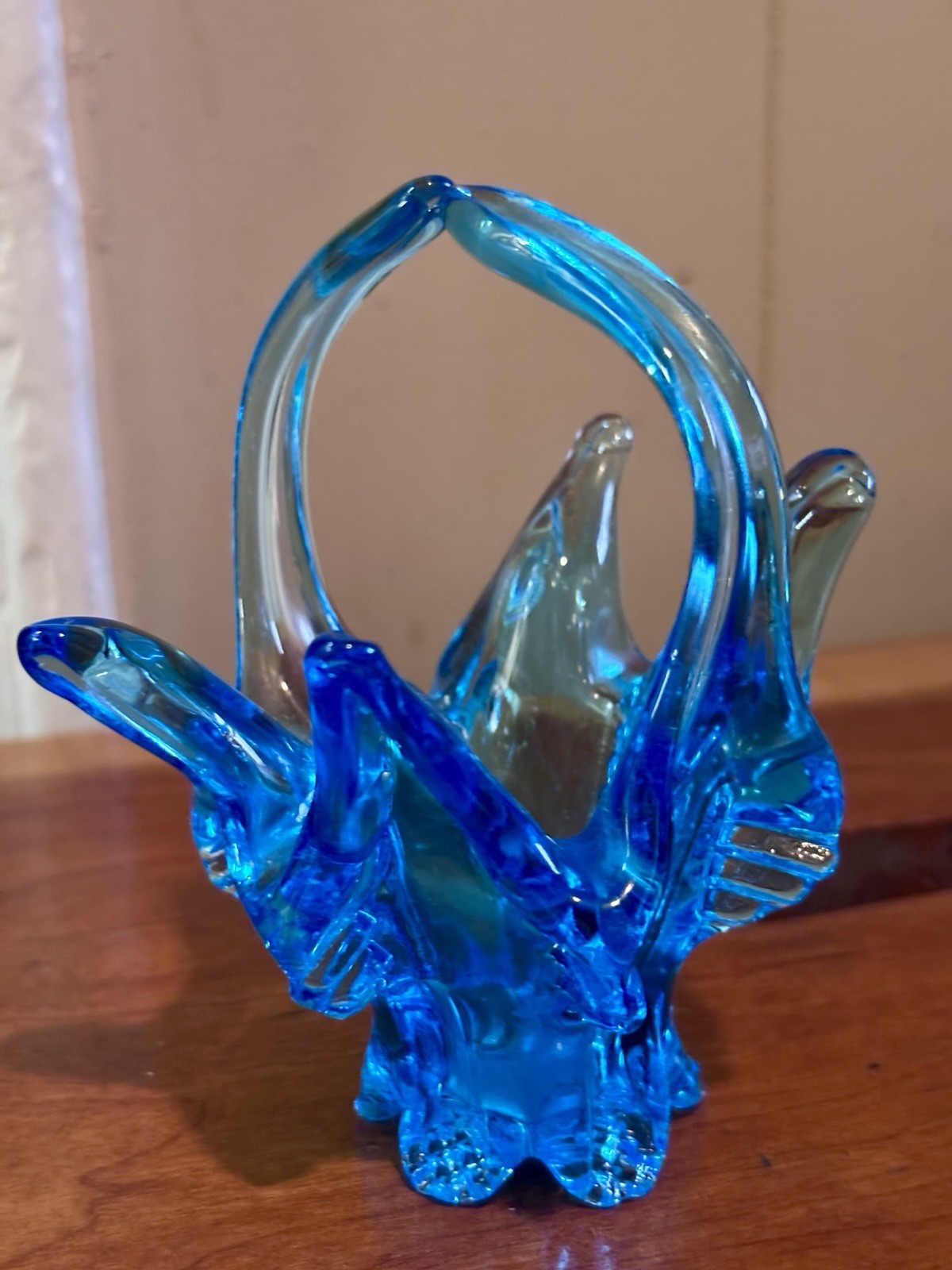 small vintage blue Chalet glass basket featuring a distinctive split handle