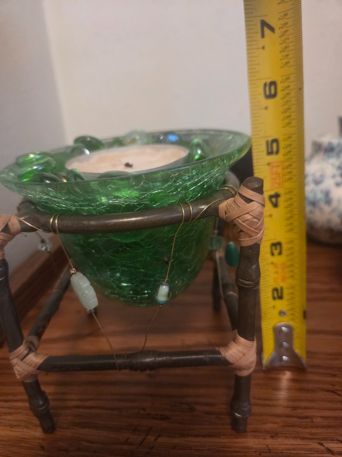 Handmade green beaded art dish, candle, decorative stones.