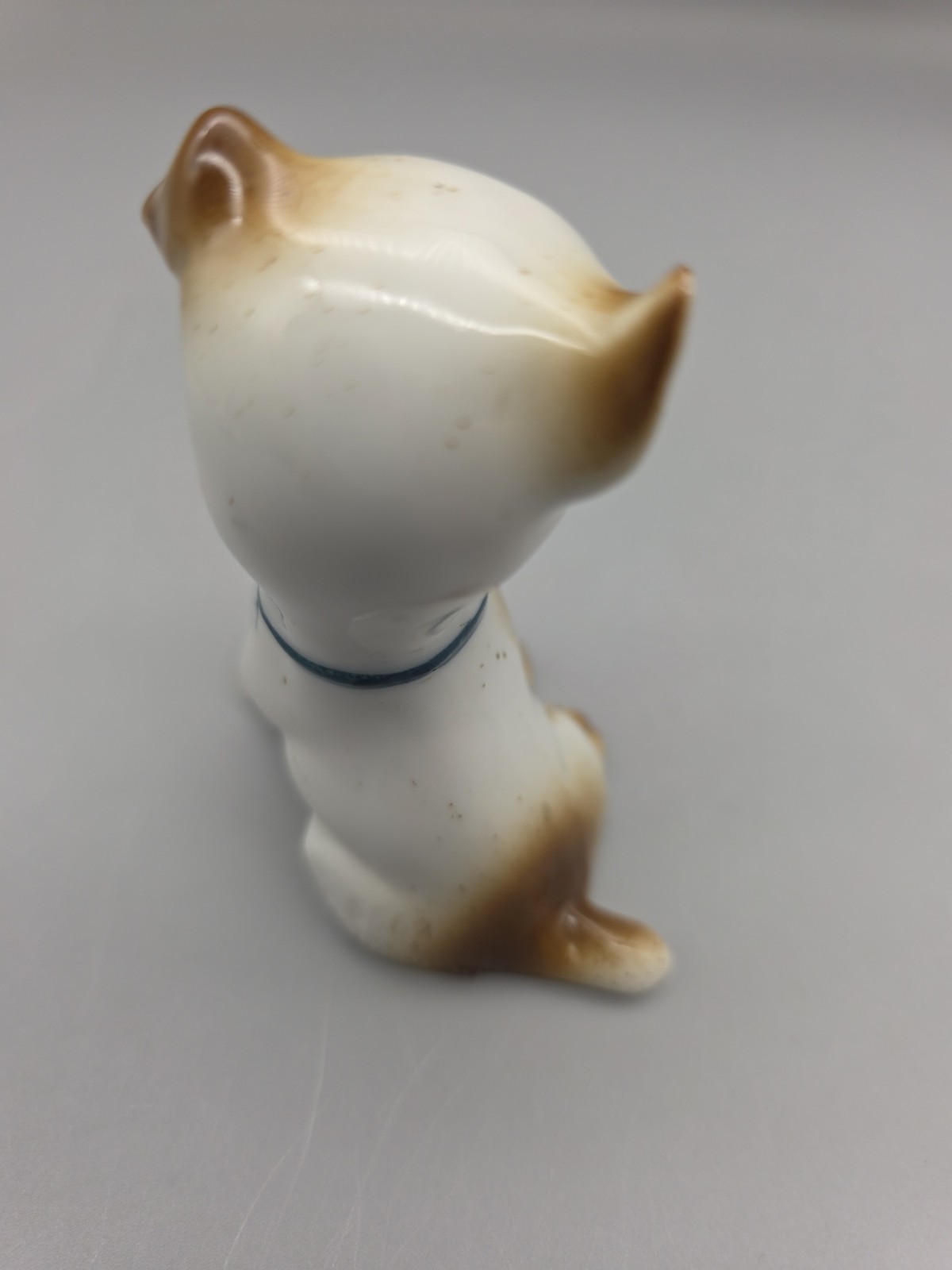 Vintage Porcelain Puppy Dog Figurine W Fly on Nose Brown Speckled Germany #5562