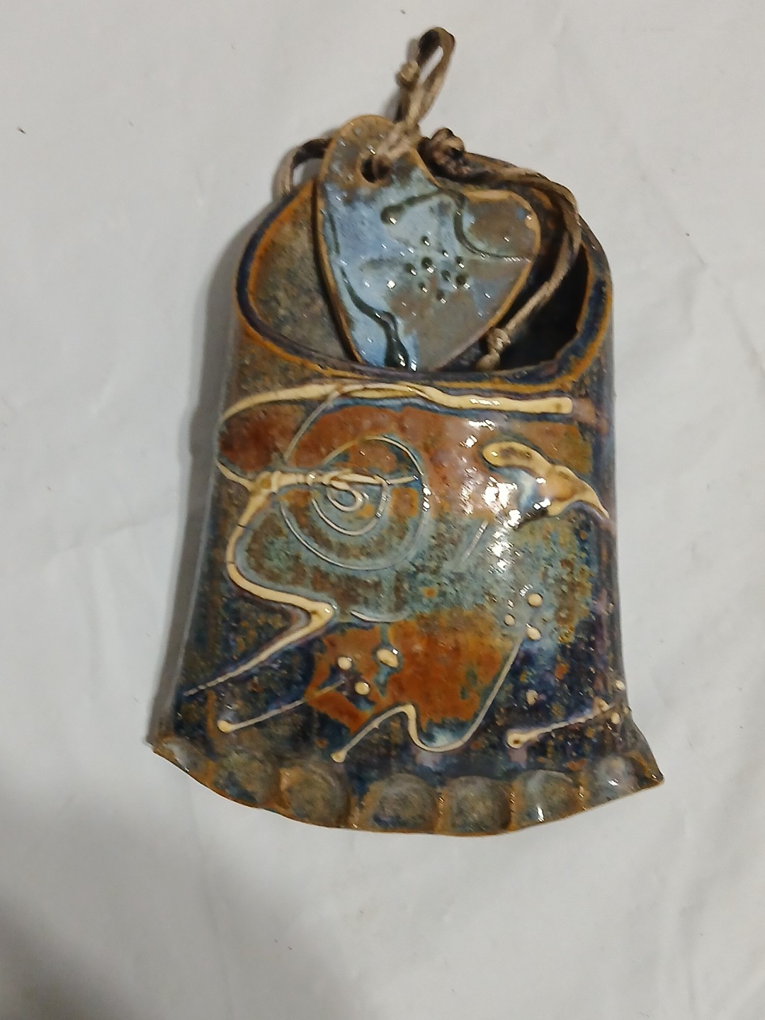 Art Pottery Wall Pocket W/attached Heart Called “Skin Sleigh bone rides again.”