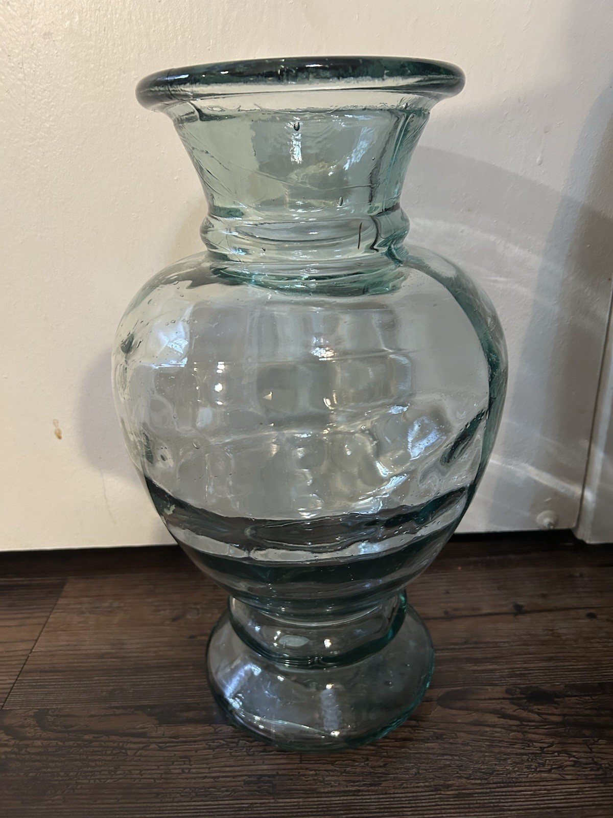 Large aqua green art glass vase with pedestal base, likely Italian.