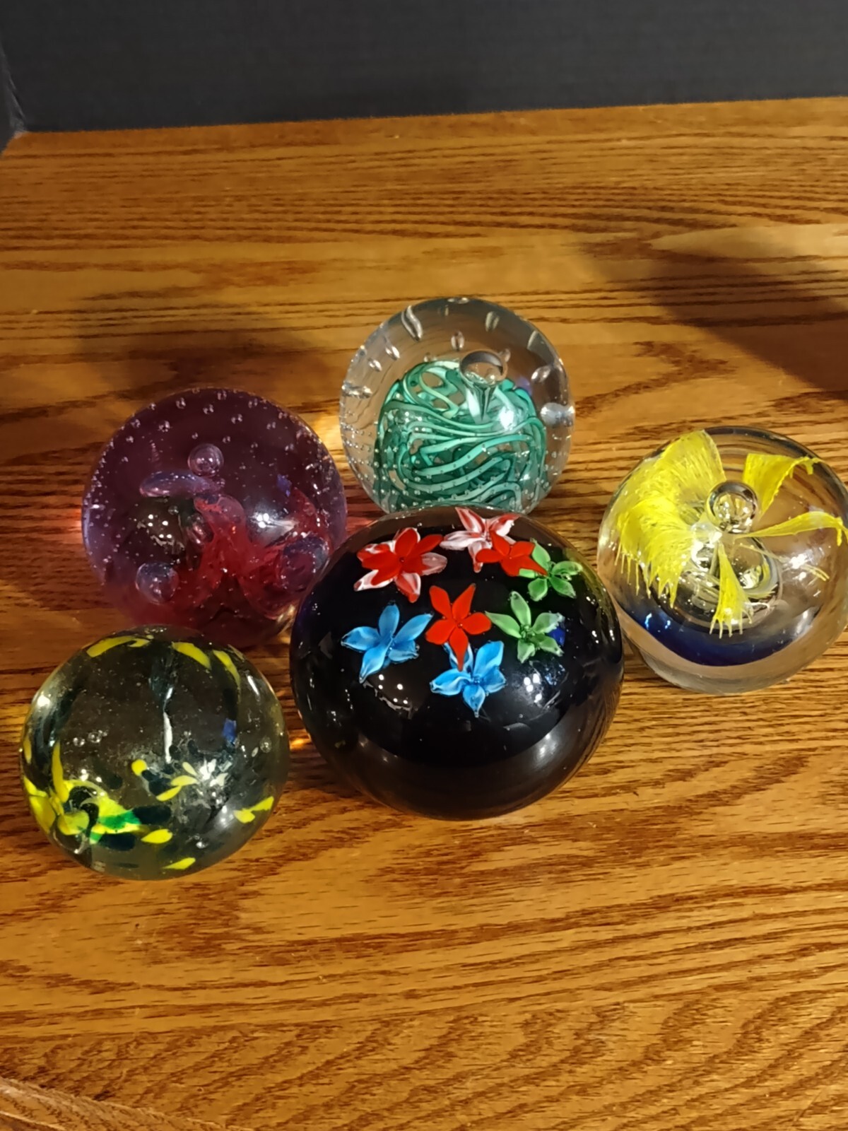 5 different beautiful hand blown art glass Crystal paperweights.