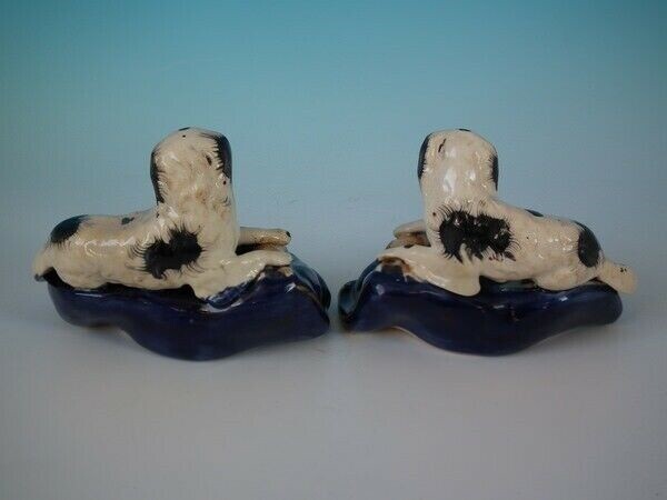 Pair Staffordshire spaniels with hare inkwells