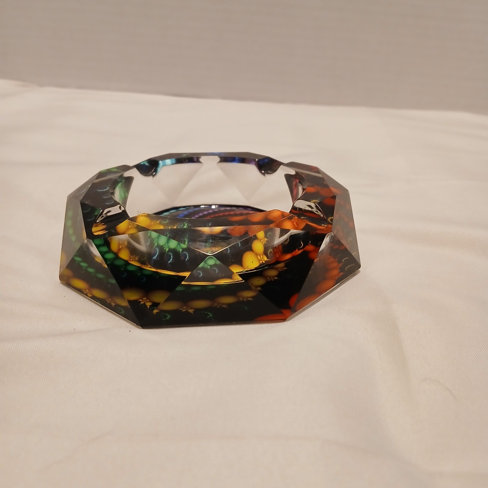 Geometric Faceted Ashtray with colors showing thru out the Facets from Bottom.