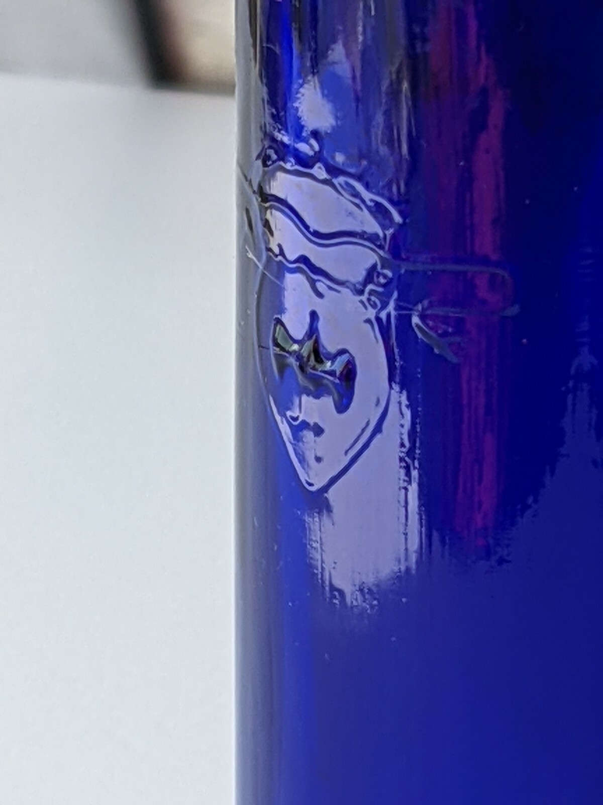 COBALT BLUE THIN CORKED BOTTLE. COAT OF ARMS SIGNED