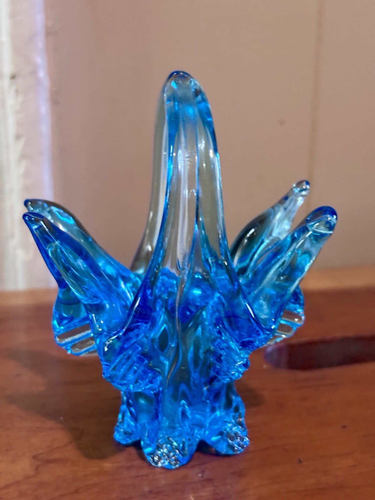 small vintage blue Chalet glass basket featuring a distinctive split handle