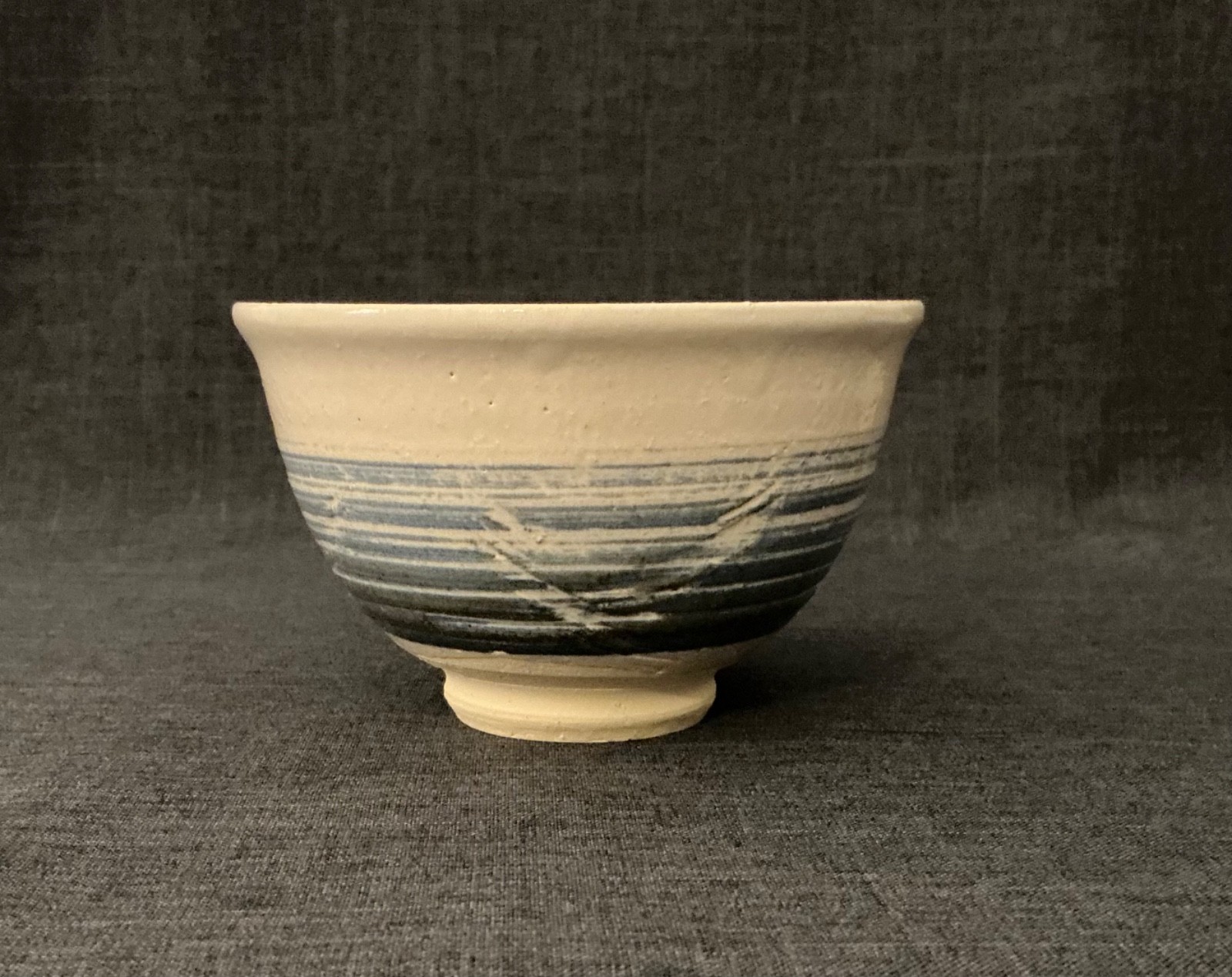 Studio Pottery – Small Cream Colored Bowl with Shades of Blue/Gray Stripes