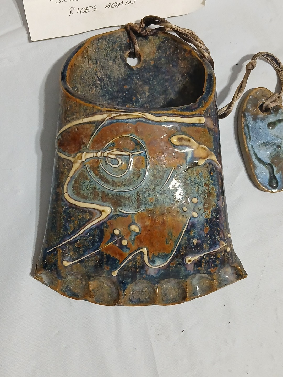 Art Pottery Wall Pocket W/attached Heart Called “Skin Sleigh bone rides again.”