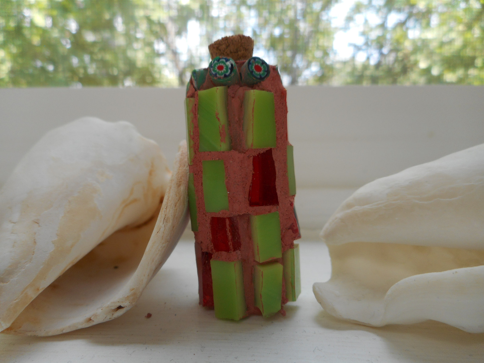 #5 MAGIC BOTTLE -1 7/8 IN.HIGH WITH MILLEFIORI BEADS AND RED/GREEN GLASS INLAID