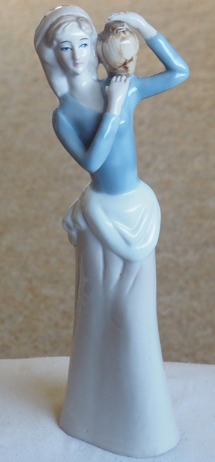 Figurine “Carlotta 1979” Lady with water vessel. 10.5″ Tall.