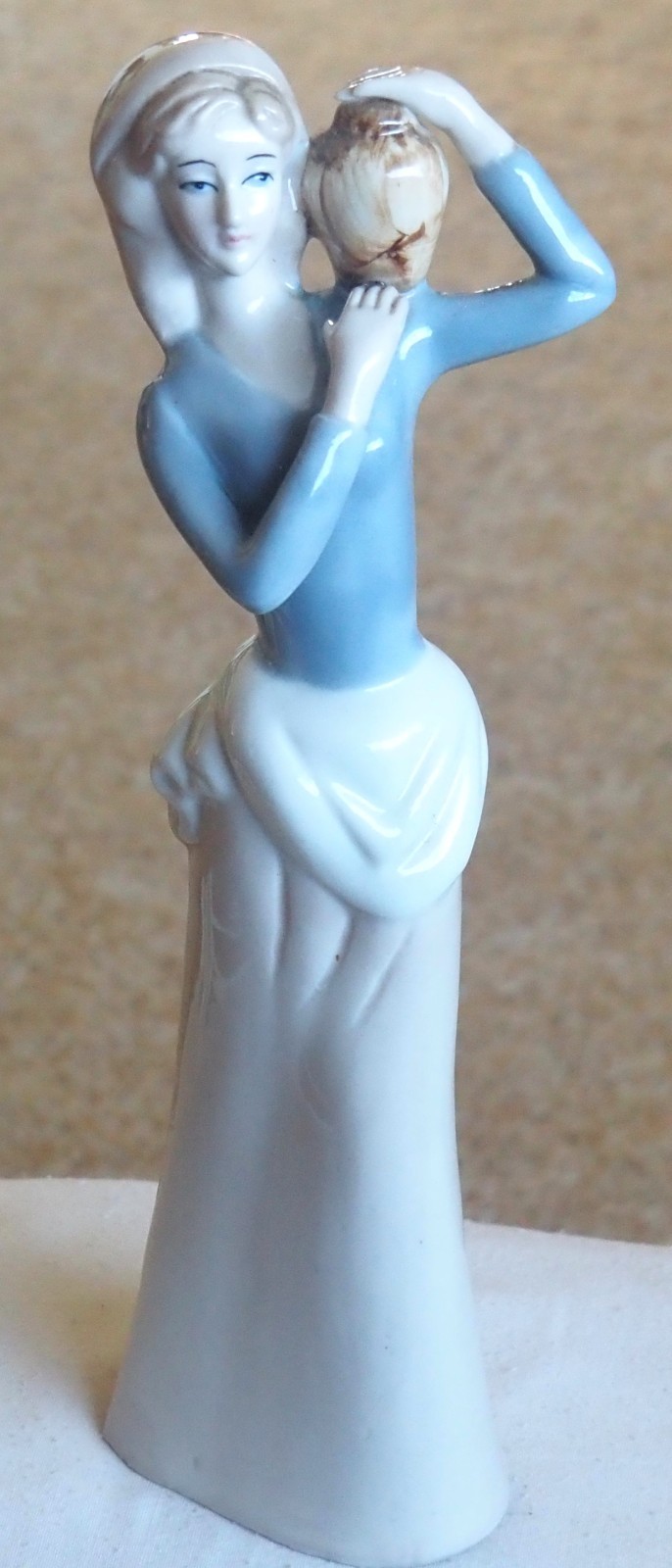 Figurine “Carlotta 1979” Lady with water vessel. 10.5″ Tall.