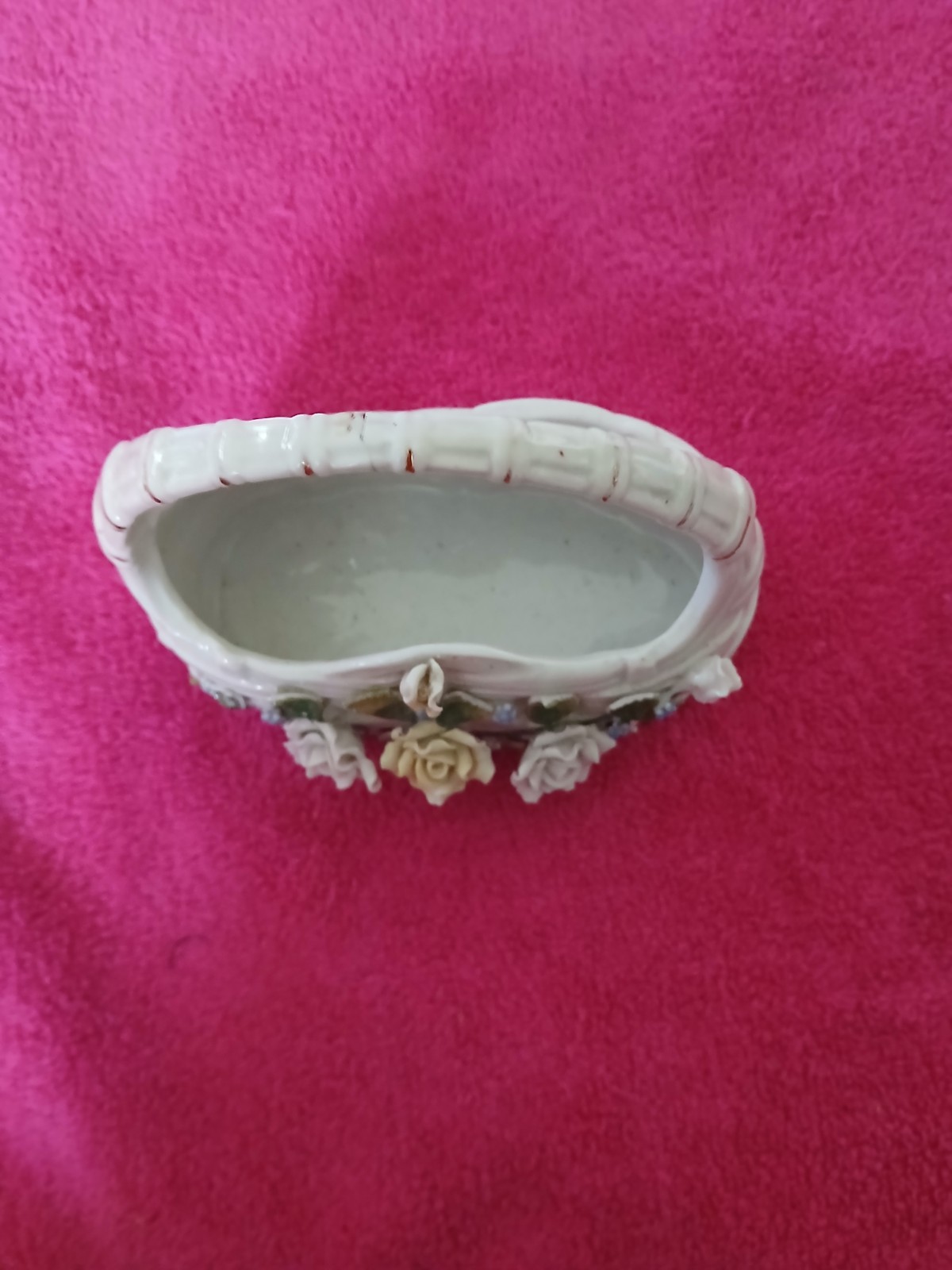 vintage porcelain basket adorned with flowers