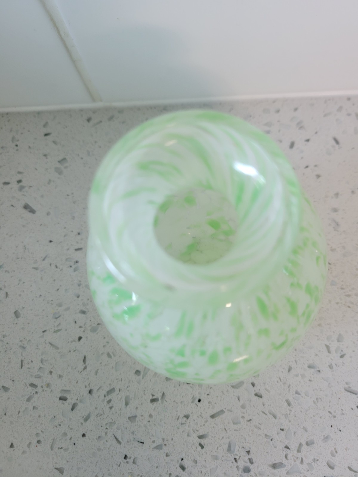 green and white splatter design art glass vase