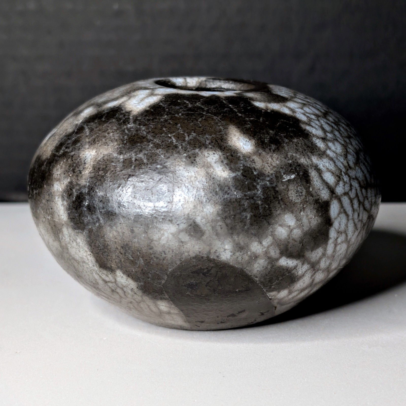 Small Naked Raku Orb “Naked Roku” Bone-White Fine-Lined Black Carbon Crackle