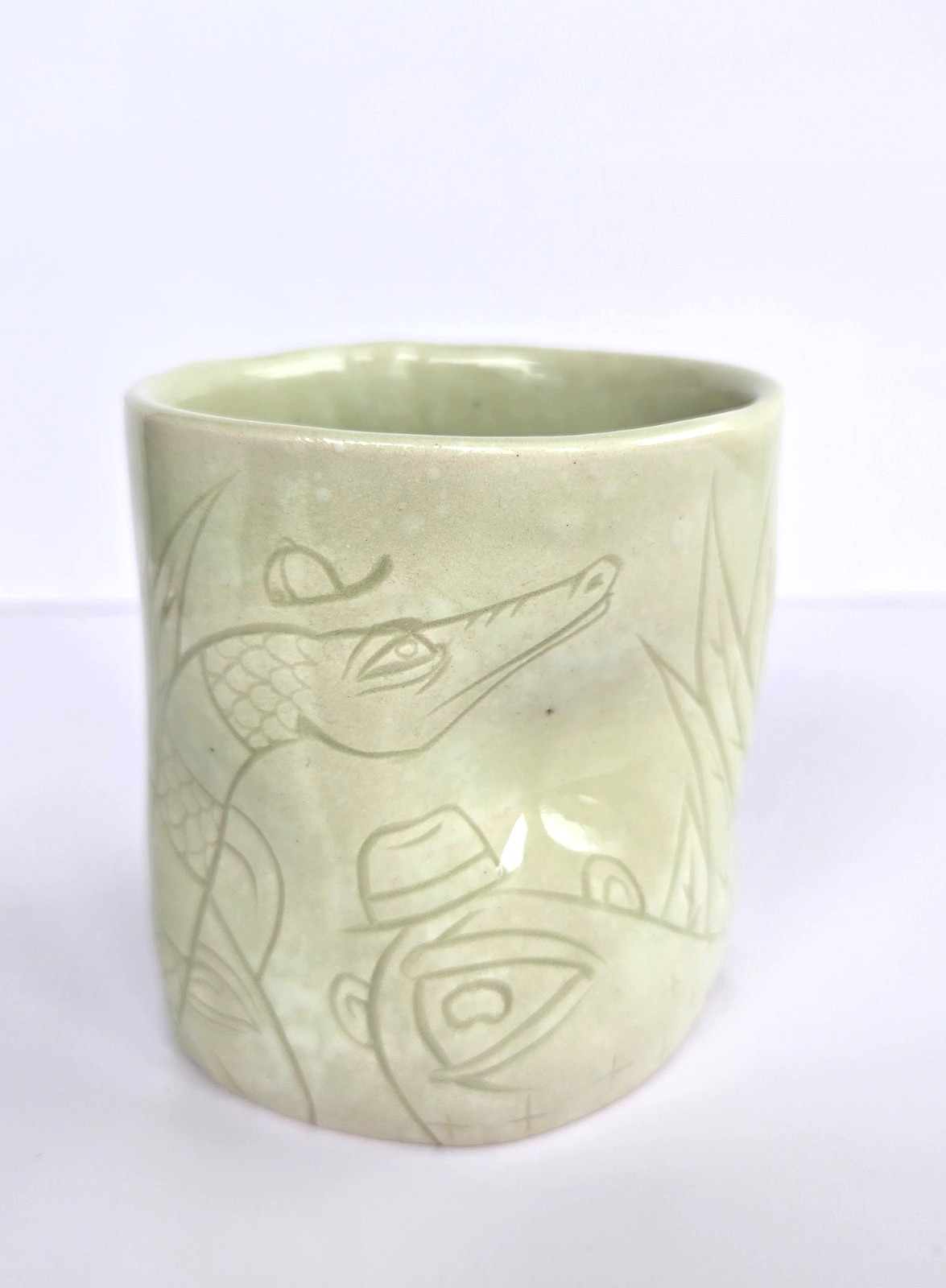 Joseph Brooks Art Pottery Cup 2022 light green glaze, cat & animal & characters