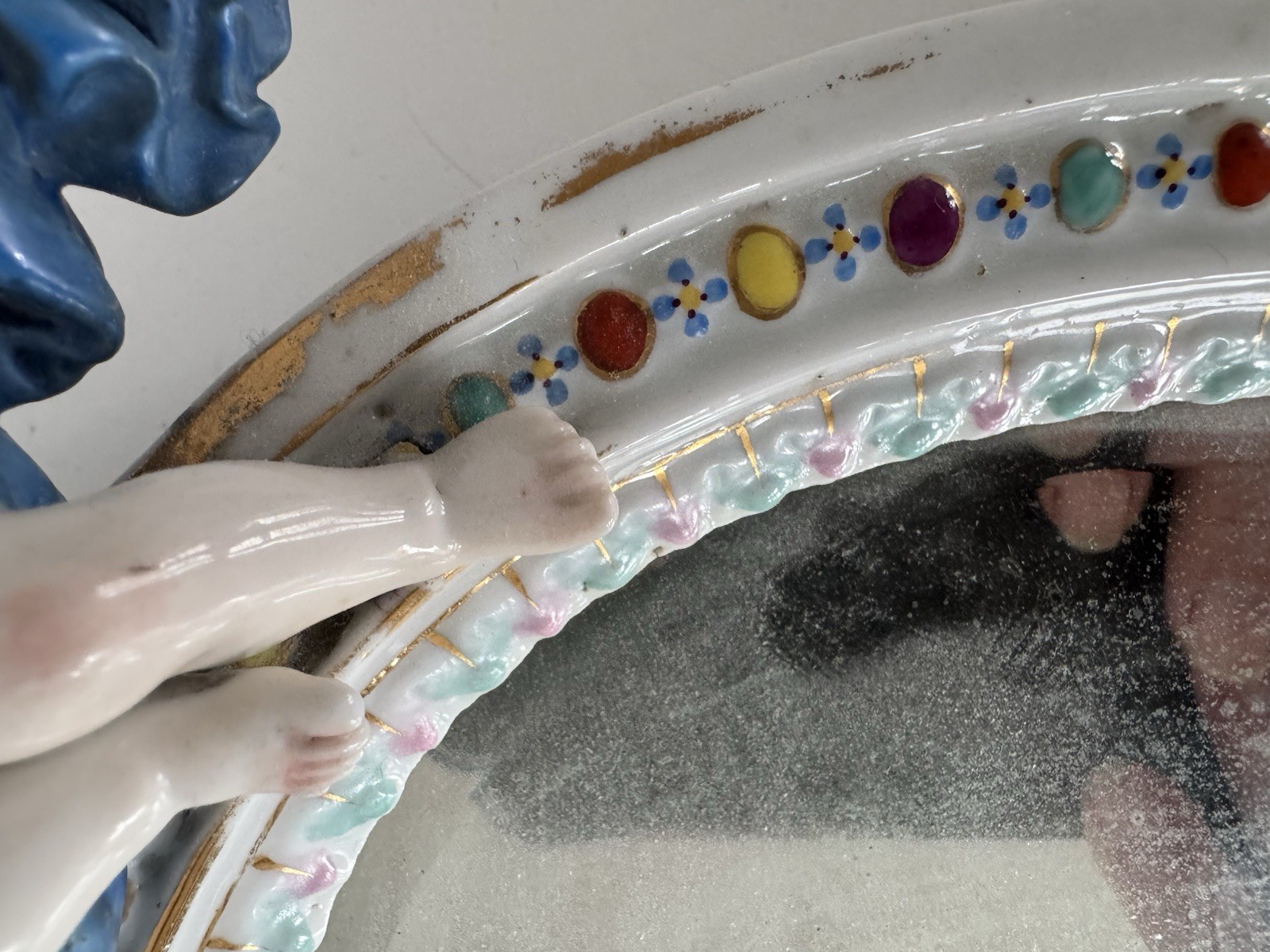 Antique Meissen porcelain mirror with original glass. Decorated with putti.