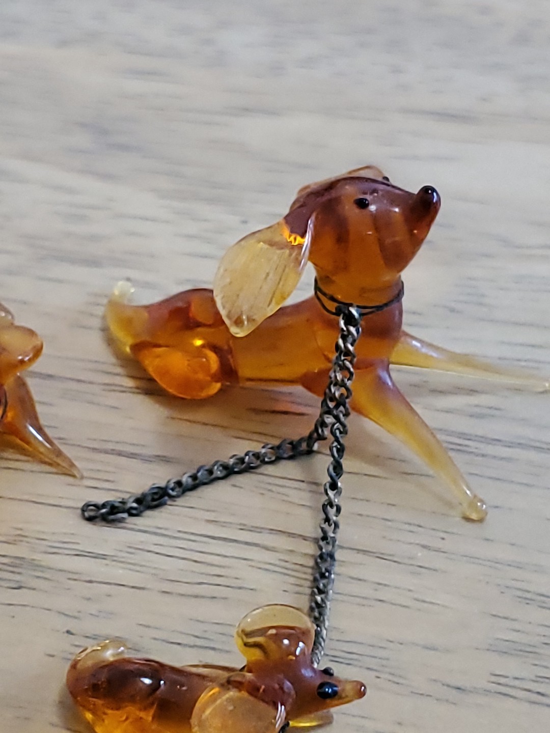 3 VTG AMBER COLORED GLASS DOG & 2 PUPPIES WITH CHAINS & SEAL ART GLASS FIGURES