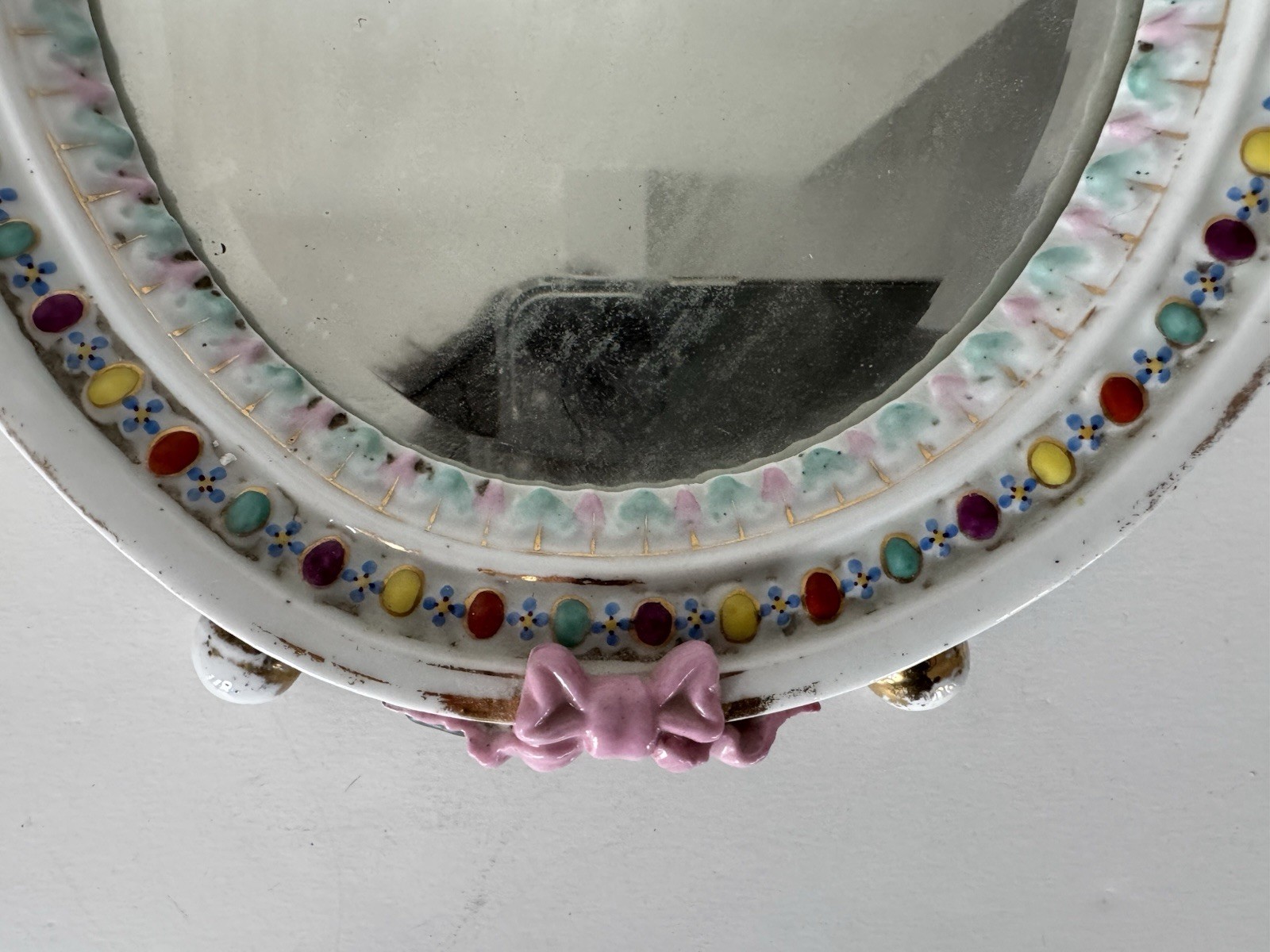 Antique Meissen porcelain mirror with original glass. Decorated with putti.