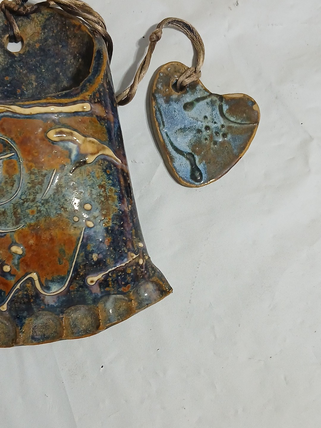 Art Pottery Wall Pocket W/attached Heart Called “Skin Sleigh bone rides again.”