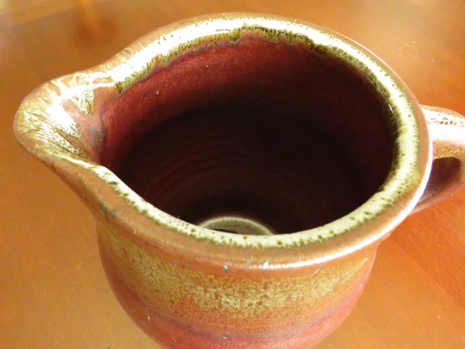Handmade ceramic pitcher or vase rustic red browns with handle spout 5″x7 1/2″