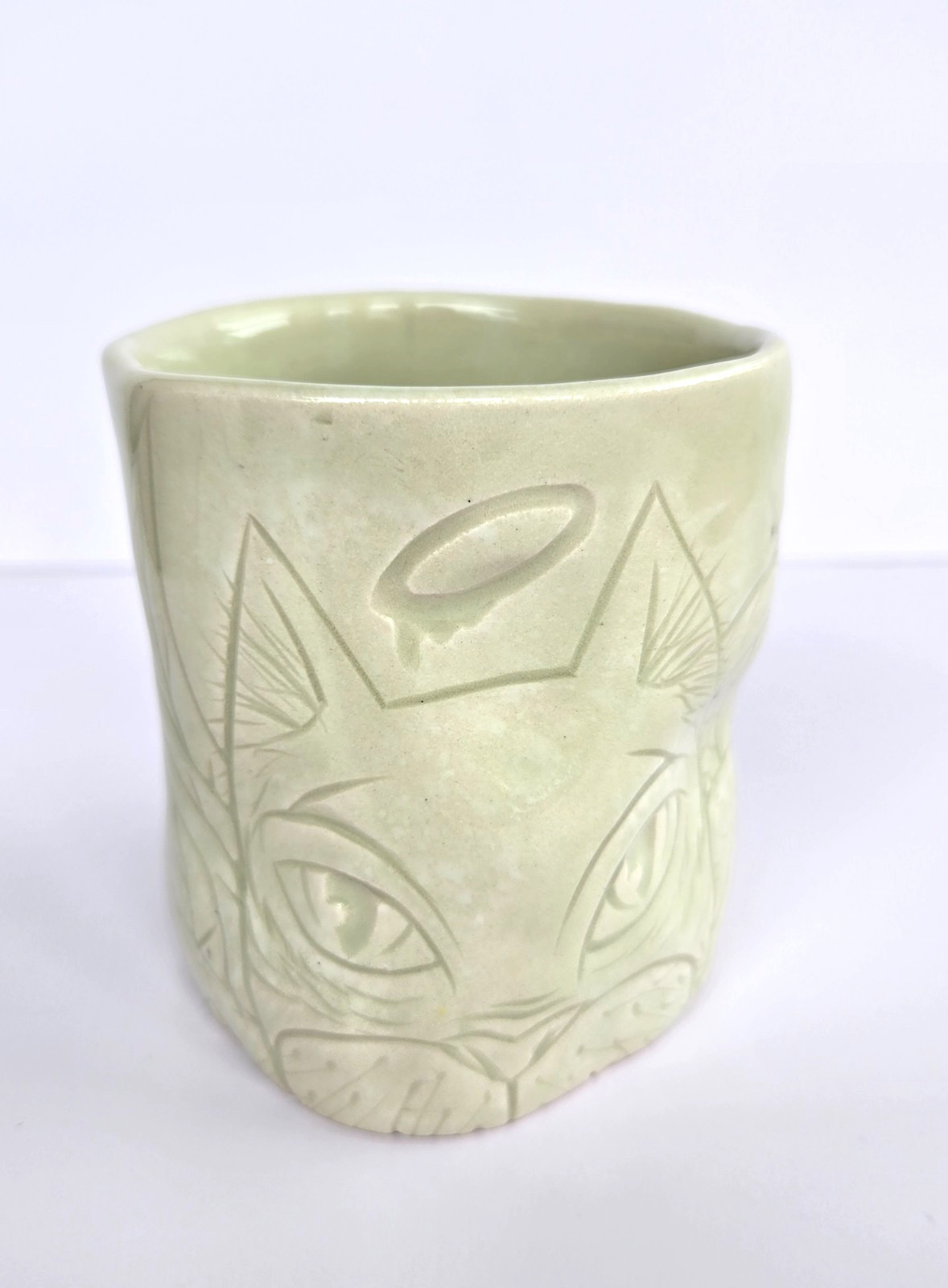 Joseph Brooks Art Pottery Cup 2022 light green glaze, cat & animal & characters