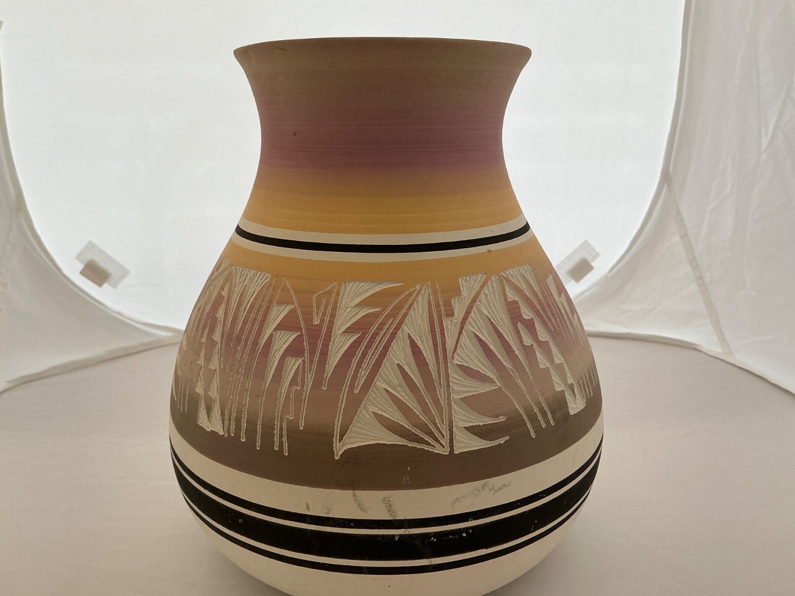 Navajo Vase , Kenho, approx 8” x 7.5” colors: pink, cream, black and taupe