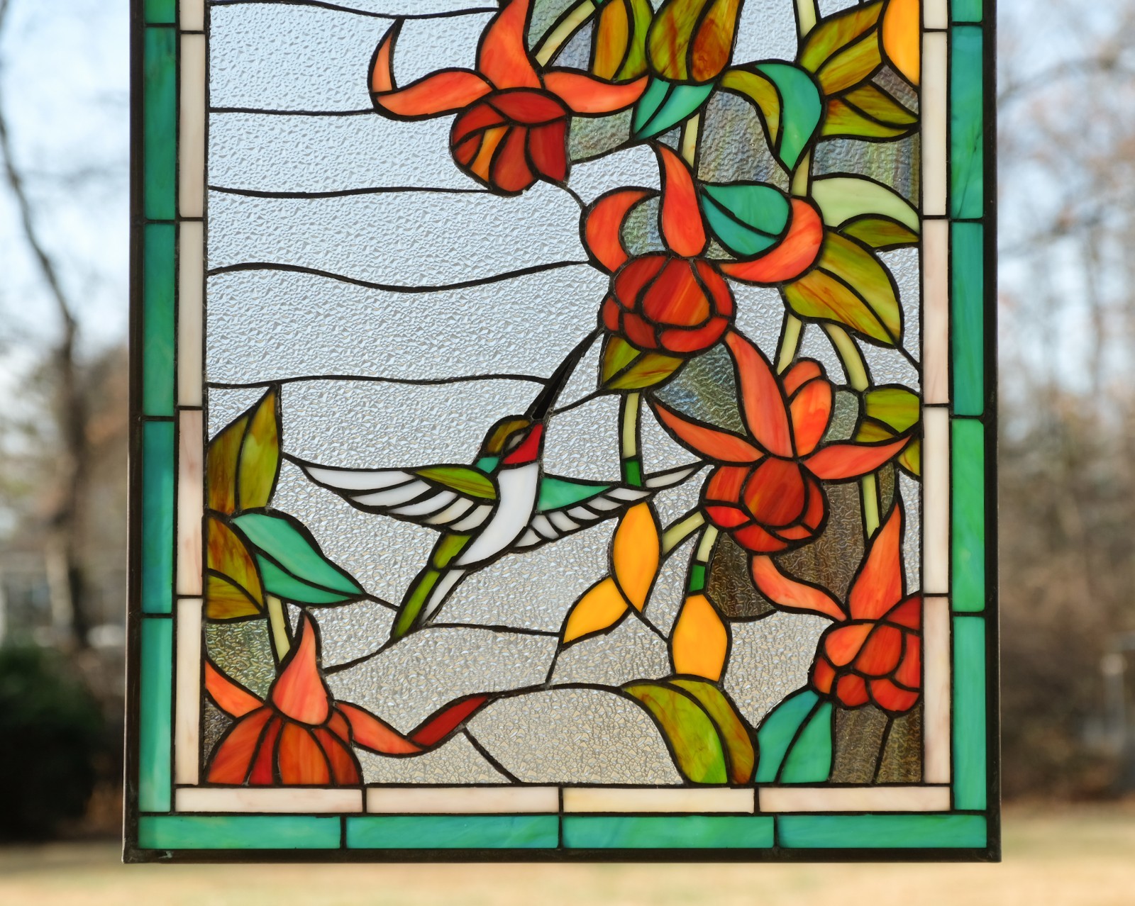 20.5″ x 34.75″ Handcrafted hummingbirds flower stained glass window panel.