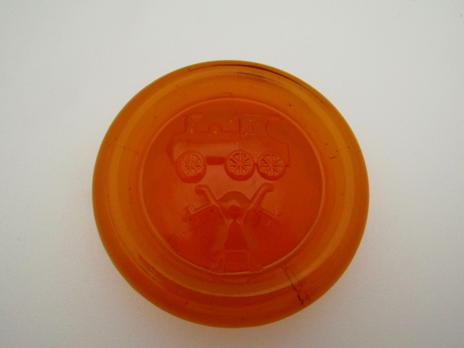 Unbranded Amber Glass 2 1/2″ Round Flat Bottom Girl With Train Paperweight 3D