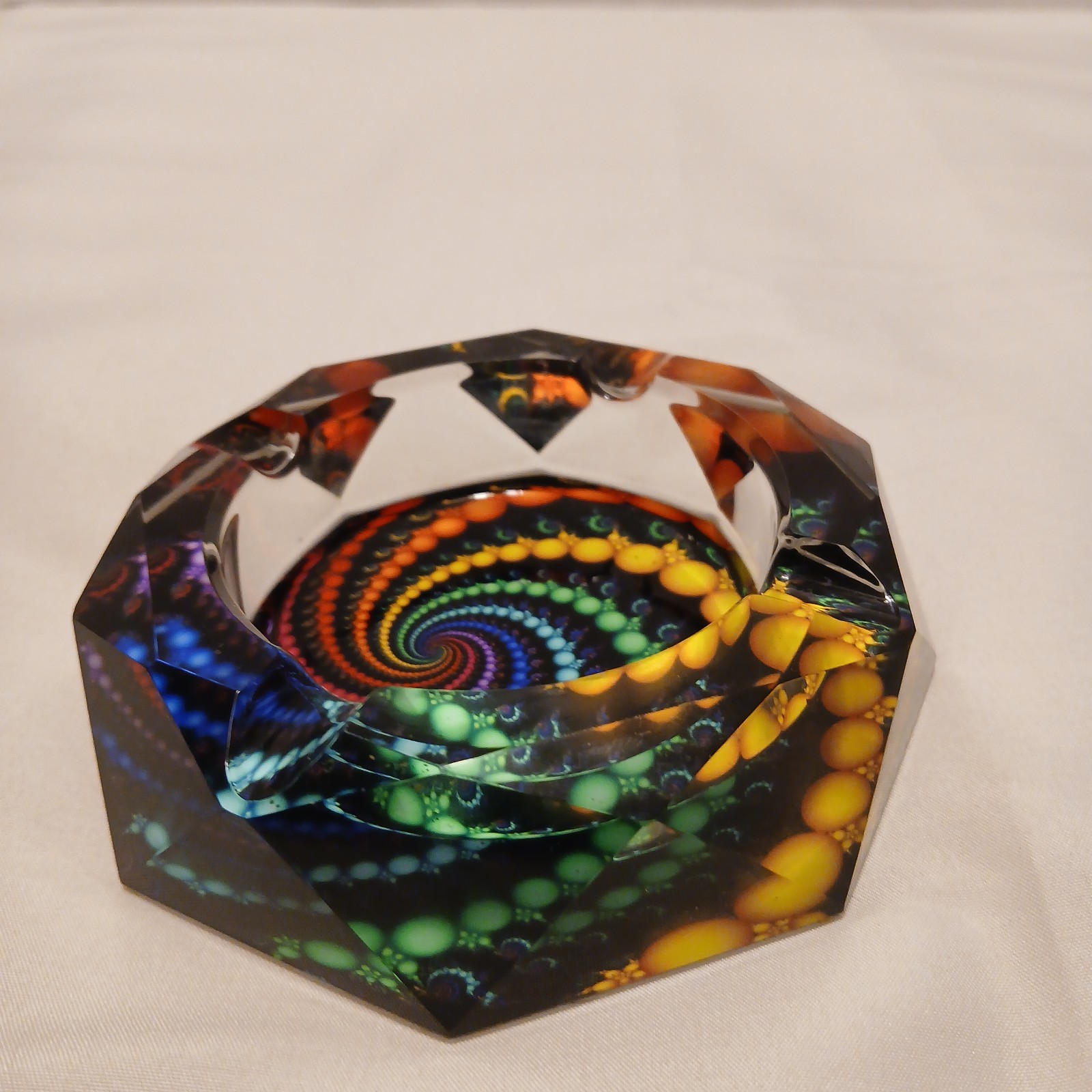 Geometric Faceted Ashtray with colors showing thru out the Facets from Bottom.